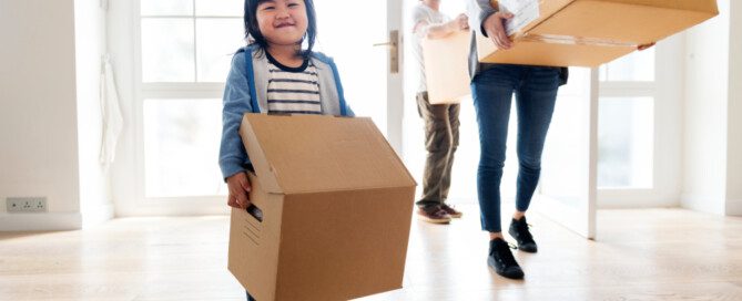 Young family in the process of eco-friendly move with a moving company