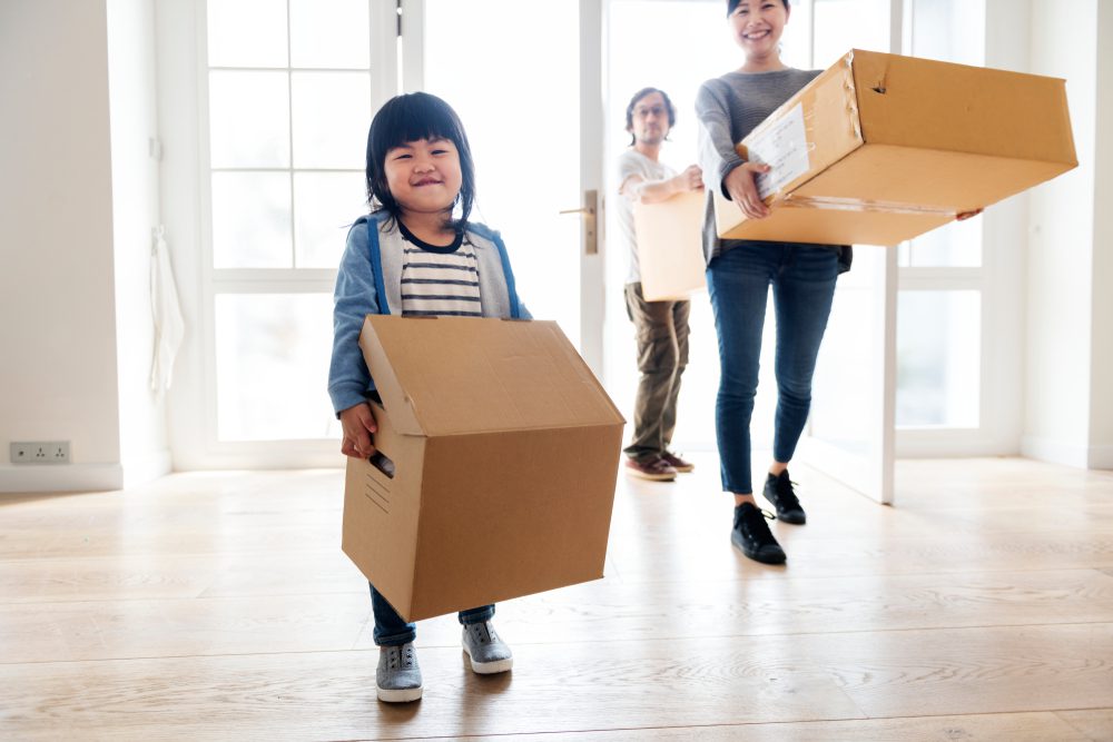 Young family in the process of eco-friendly move with a moving company