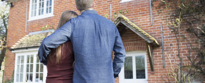 homeowners looking at newly purchased home